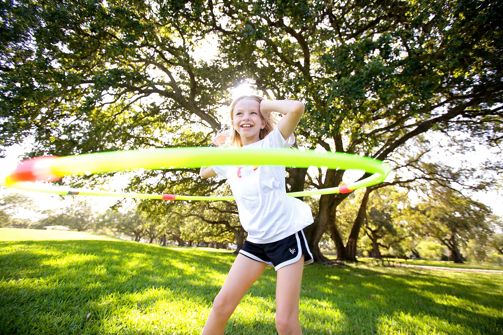 young girl in park with hula hoop_Robert-Holland.jpg