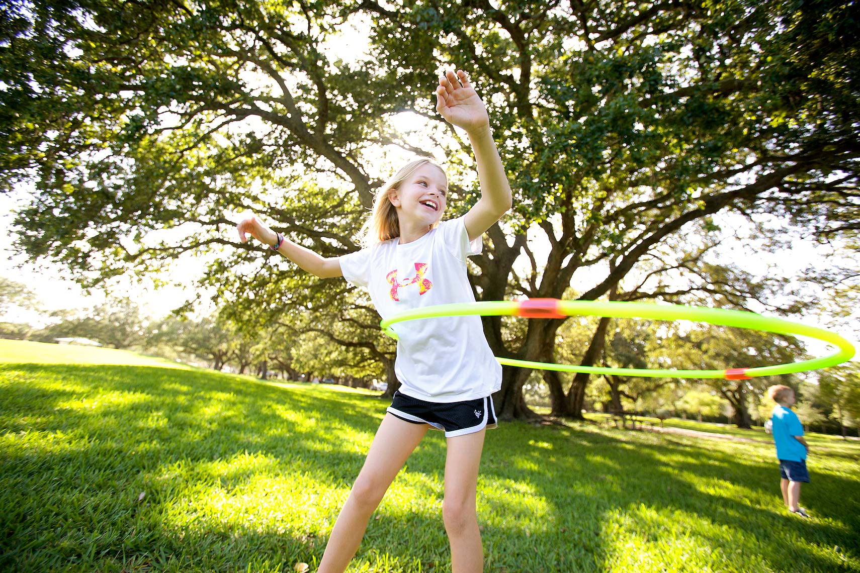 young girl using hula-hoop in park_2166_Robert-Holland.jpg