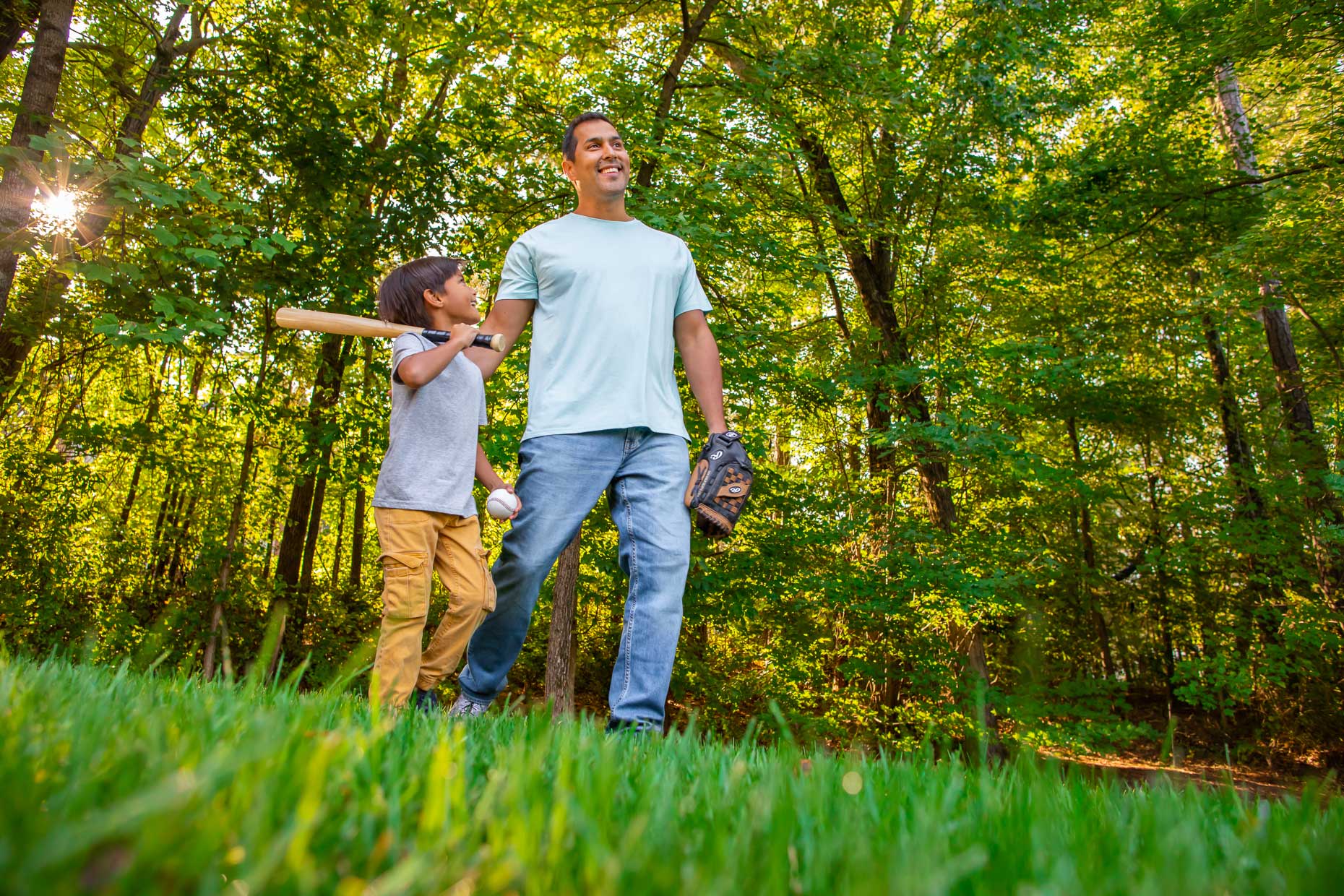 _00582_father-and-son-in-backyard-after-playing-baseball_Robert_Holland