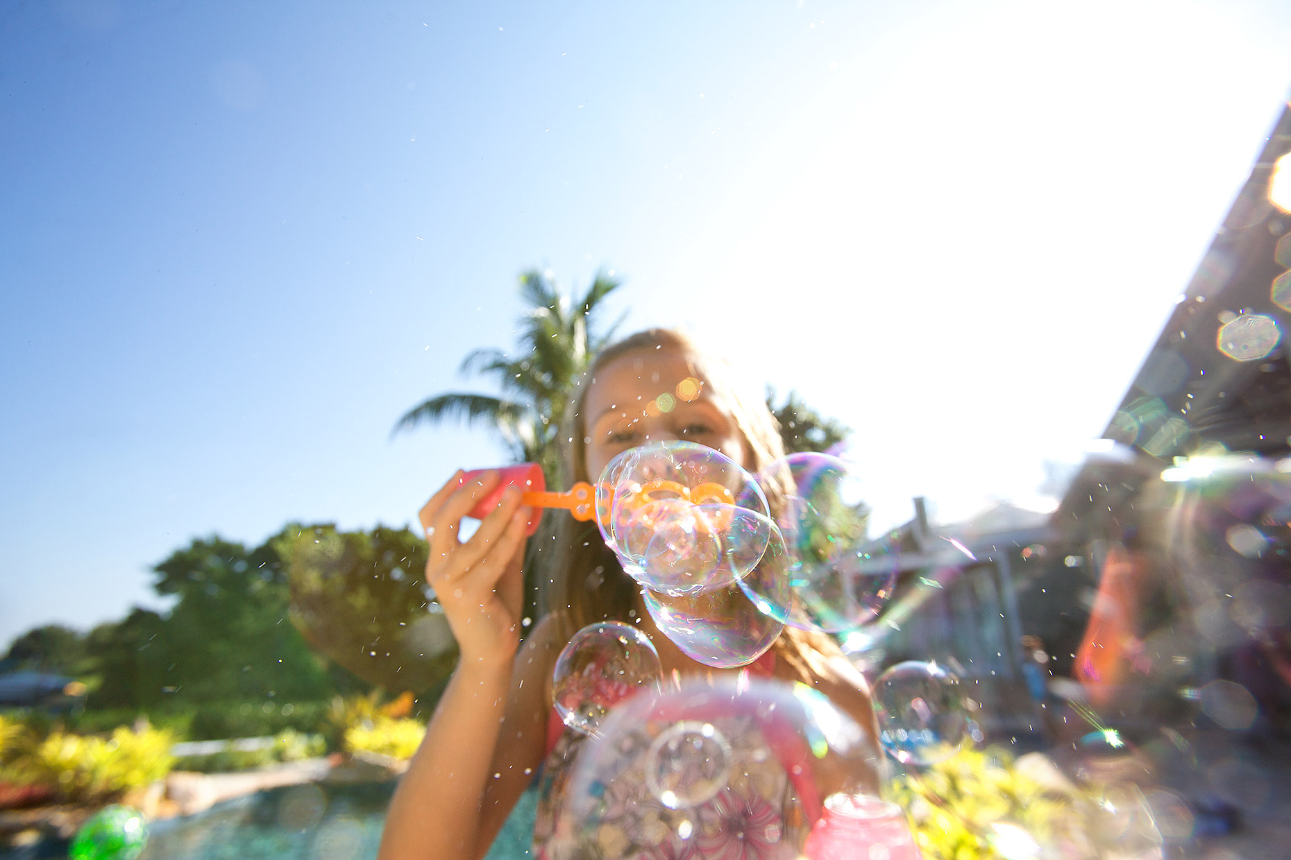 young girl blows soap bubbles pov_Robert_Holland.jpg