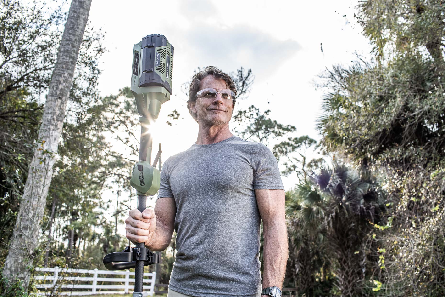 _MG_5498_homeowner posing with Green Machine grass trimmer__RobertHolland