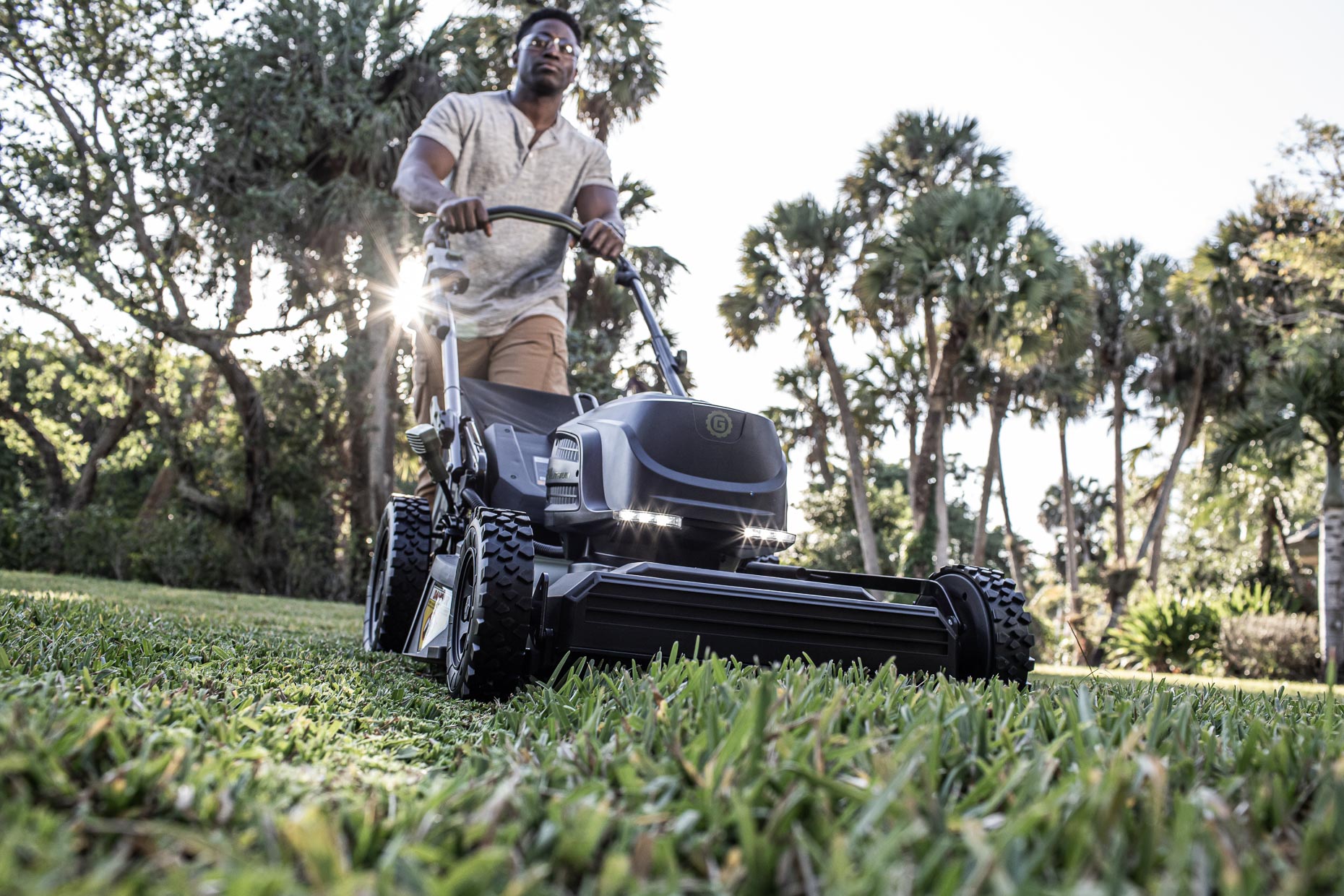_MG_5717_low angle view of man cutting grass with lawnmower__RobertHolland