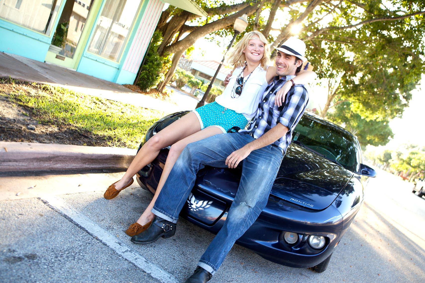 two young people on hood of car_Robert-Holland.jpg
